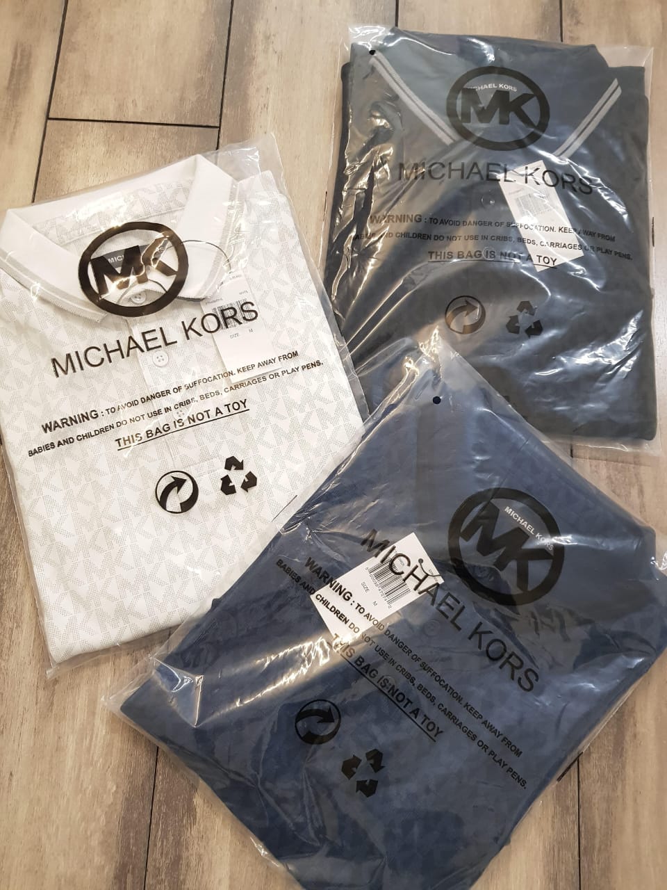 MICHAEL KORS INTERLOCK FEBRICK POLO -52PCS